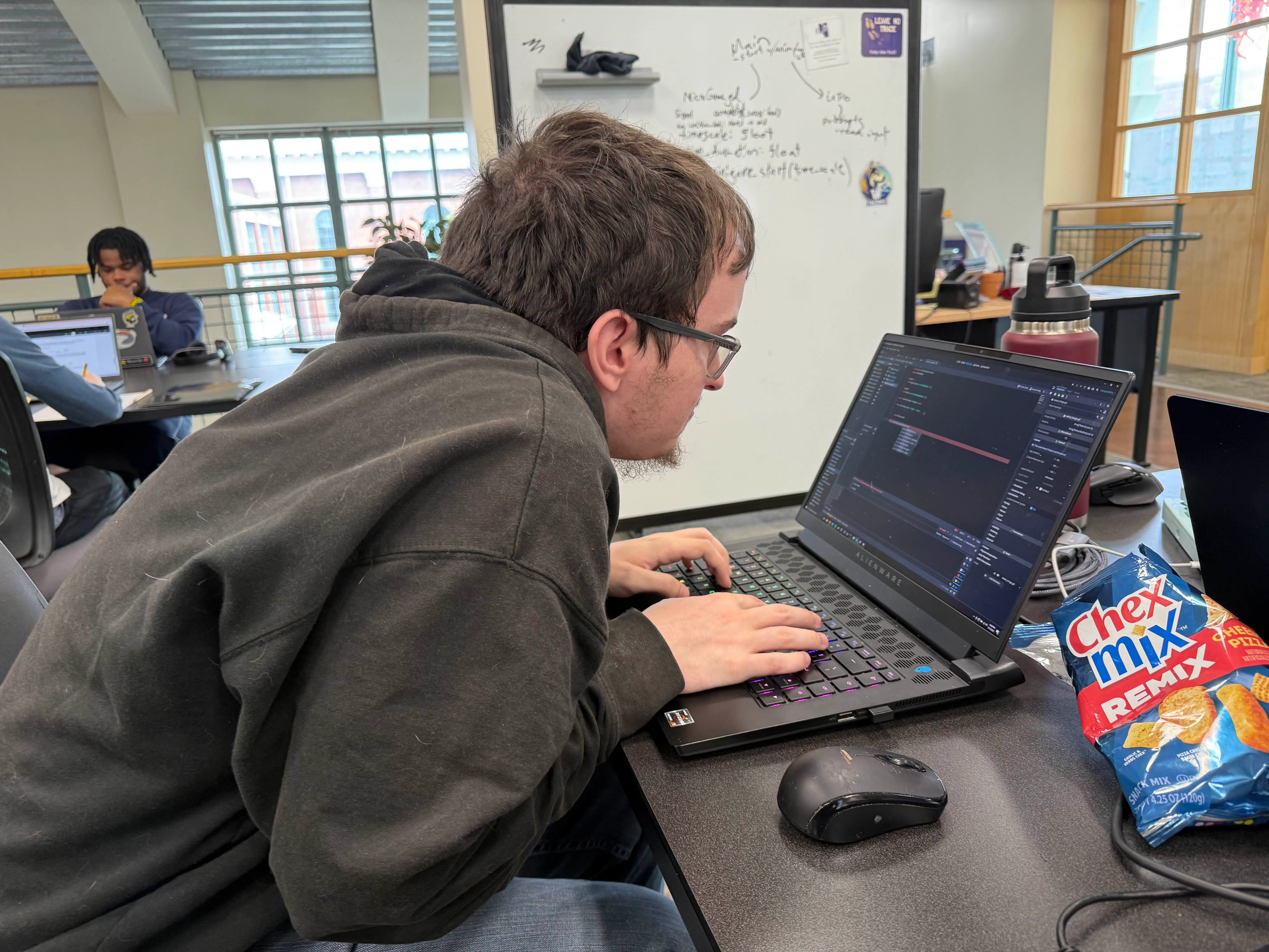 Picture of the myself hard at work on a microgame for Captcha'd.
